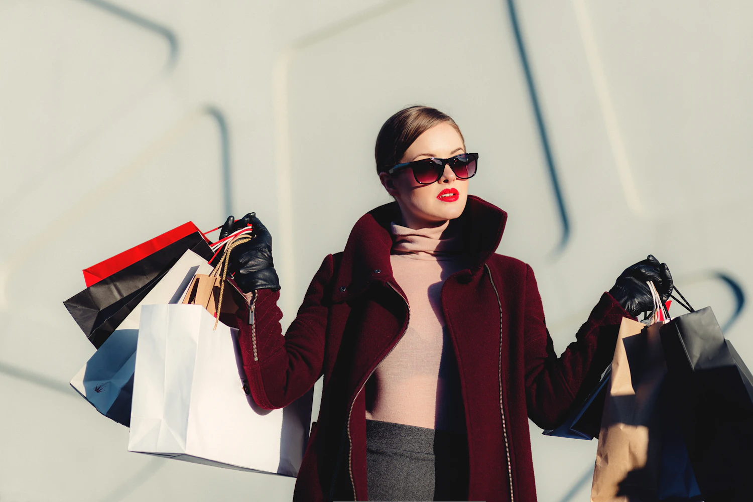 Woman carrying shopping bags on a city street